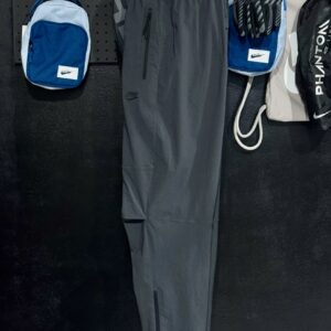 Nike Tech Pantalon tissé à ourlet ouvert